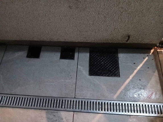 A well-designed driveway drainage system, preventing water accumulation and protecting the property.