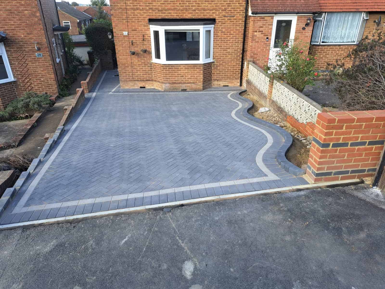 A newly paved driveway with a modern design.