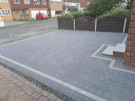 A newly paved driveway with a modern design, showcasing the quality of our paving services.